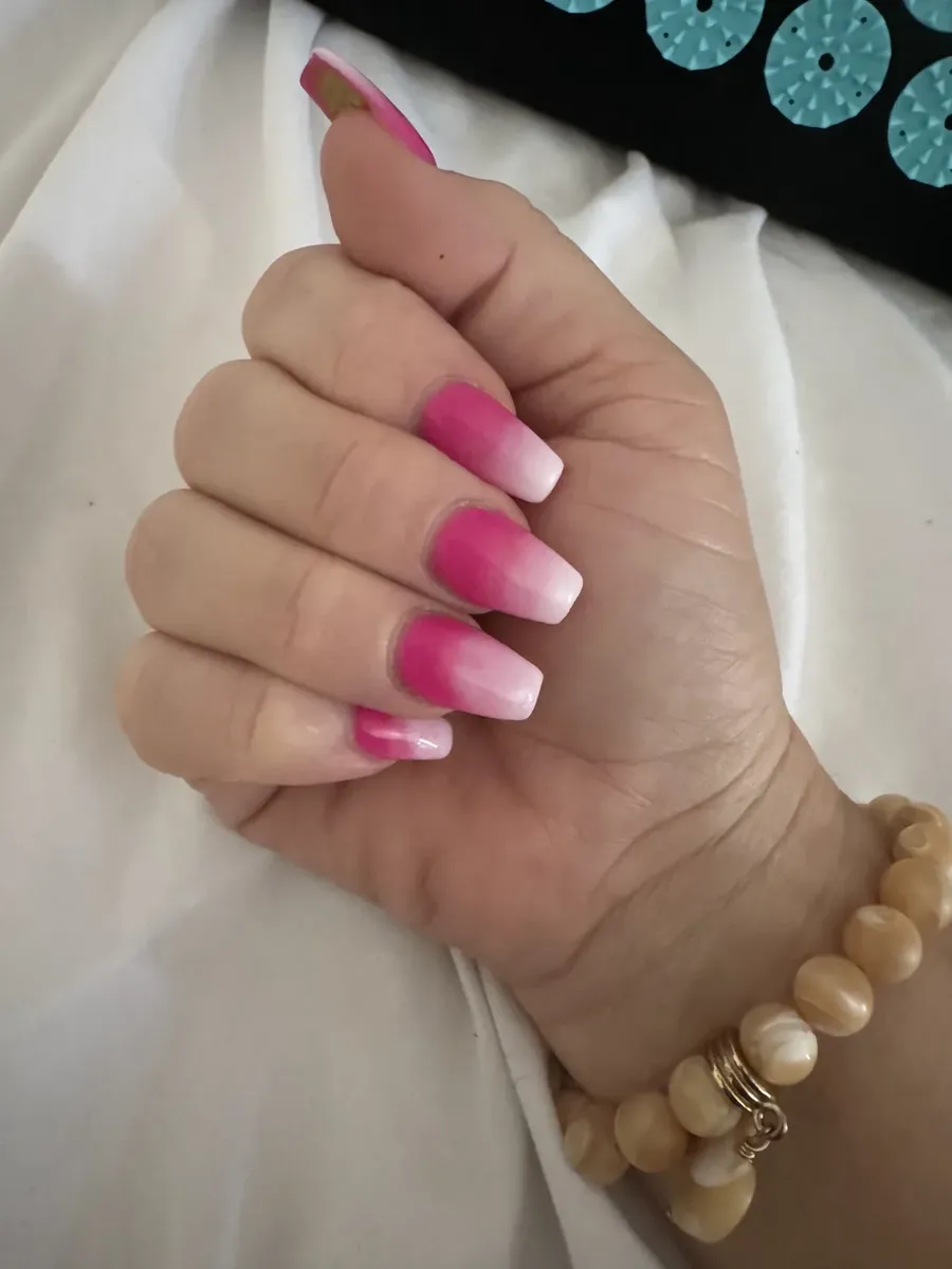 Pink ombré nails fading from hot pink to white